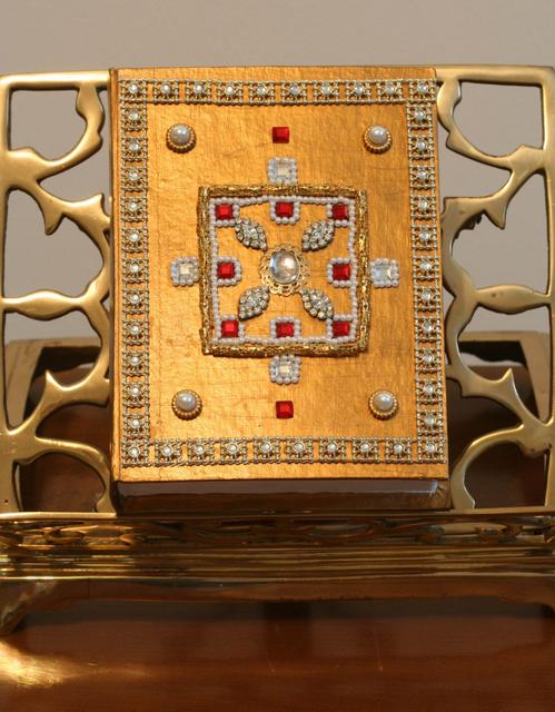 A smaller cardboard-based book box, felt-lined, decorated with faux gemstones.  $55